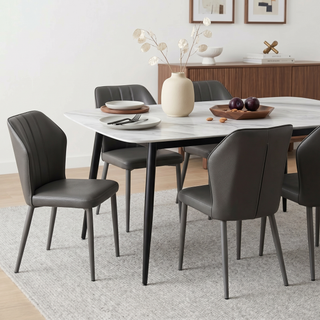  Italian Dining Table features a sleek, modern design with a ceramic tabletop showcasing a refined marble pattern. 